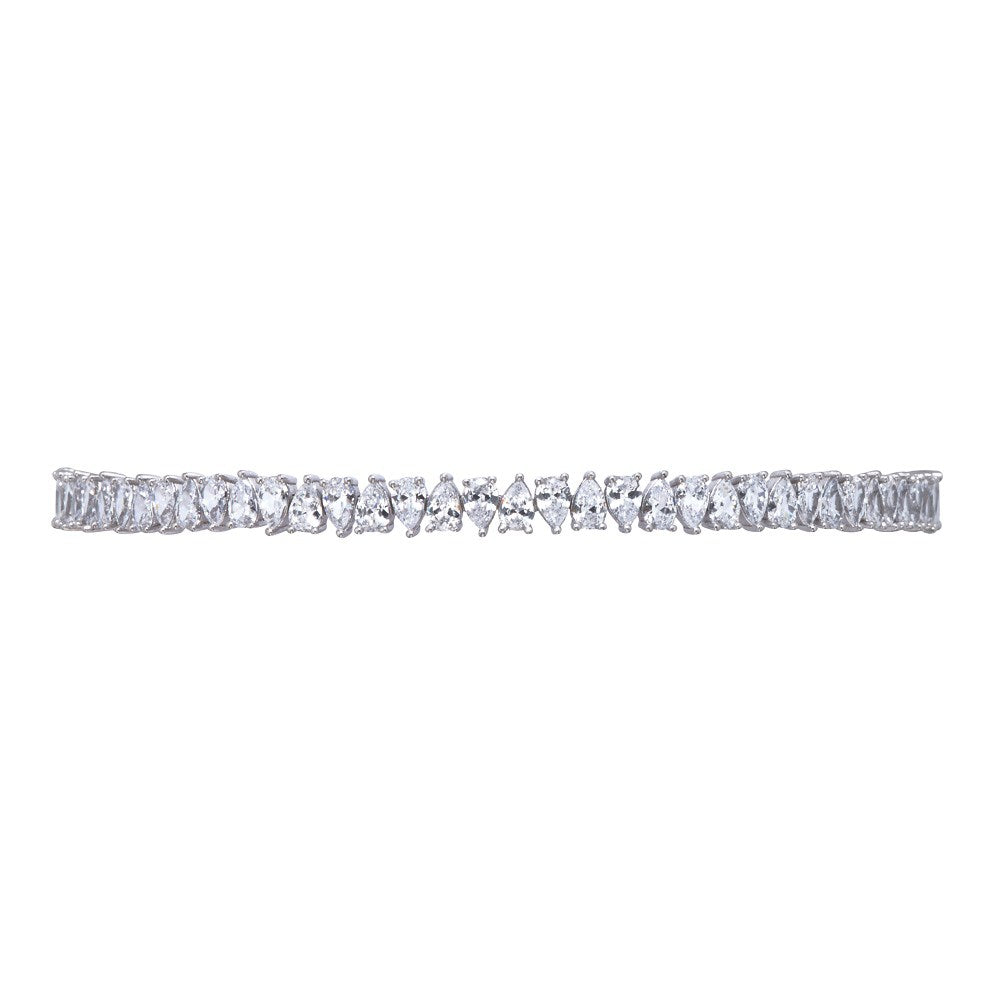 The FALLON Jagged Edge Pear Toggle Choker Necklace in rhodium is made from rhodium-plated brass and cubic zirconia crystal.  Adjustable to any neck size.