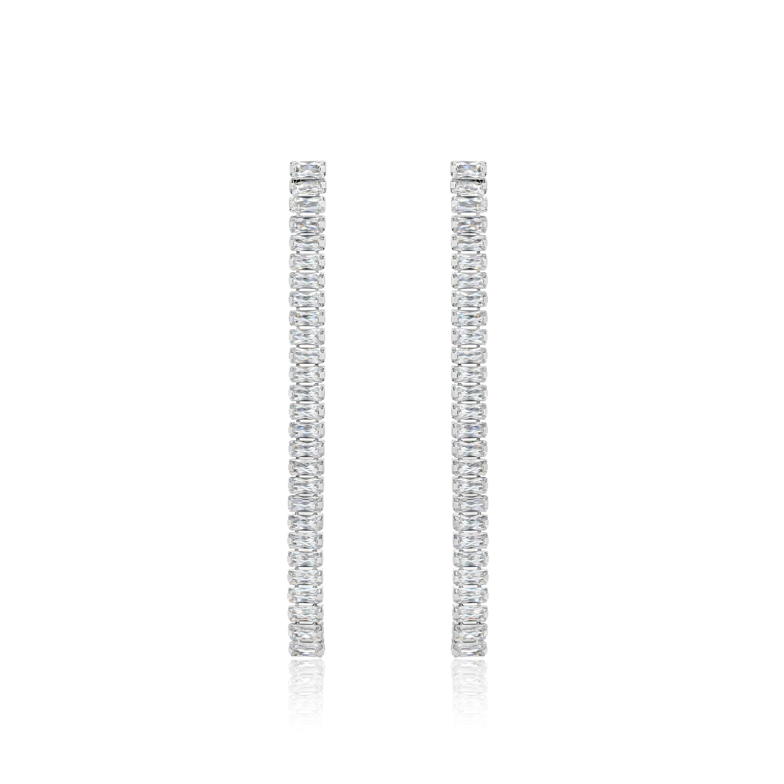 a pair of diamond earrings on a white background