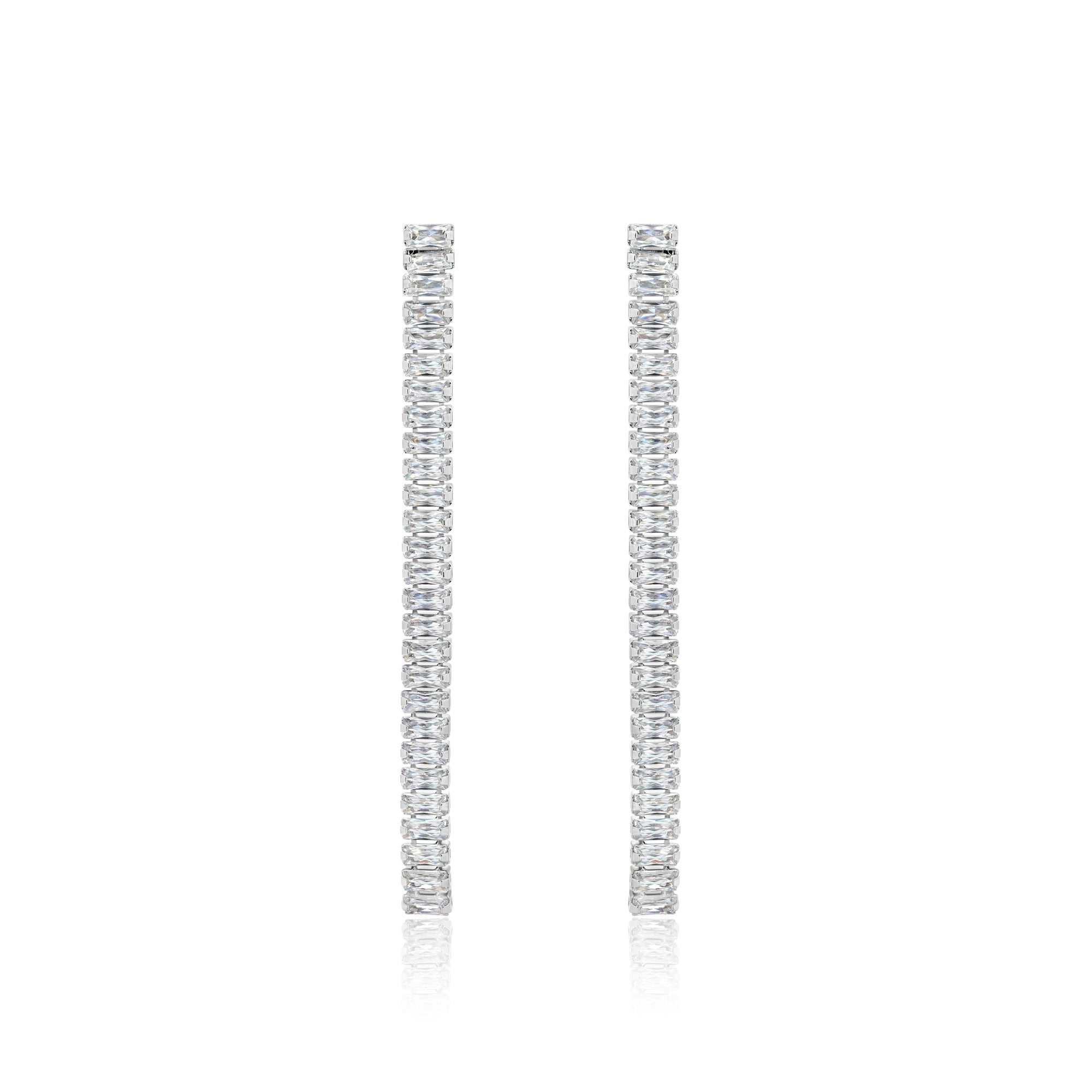 a pair of diamond earrings on a white background