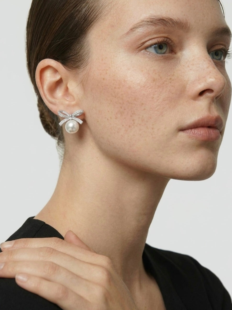 PAVÉ BOW PEARL STUD EARRINGS