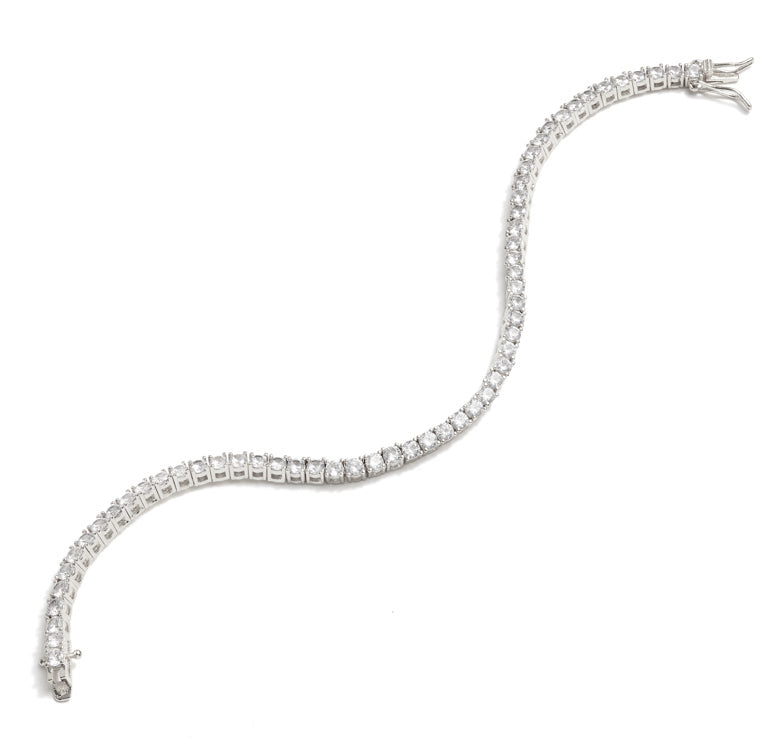The FALLON Grace Tennis Bracelet in rhodium. Rhodium-plated brass and cubic zirconia crystal. Simple, every day jewelry. 