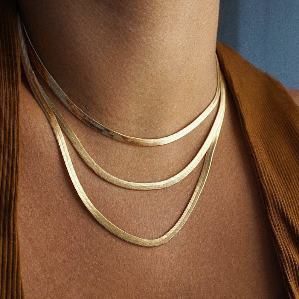 The FALLON Medium Herringbone Chain Necklace in gold plated brass.
