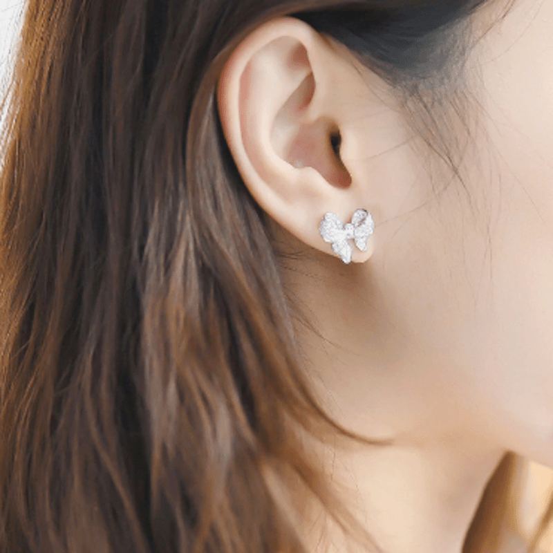 PUFFY BOW STUD EARRINGS - RHODIUM